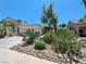 Charming home with well-maintained landscaping and a desert-style yard at 13 Desert Dawn Ln, Henderson, NV 89074