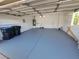 Spacious two-car garage with ample storage shelving and epoxy-coated floor at 13 Desert Dawn Ln, Henderson, NV 89074
