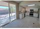 Bright kitchen with stainless steel appliances, granite countertops, and backyard view at 13 Desert Dawn Ln, Henderson, NV 89074