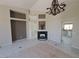 Large living room boasts a fireplace, high ceilings, and a view into the modern kitchen at 13 Desert Dawn Ln, Henderson, NV 89074