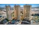 Stunning aerial shot showcasing high-rise buildings, pools, and lush greenery creating an oasis in the city at 135 E Harmon Ave # 809, Las Vegas, NV 89109