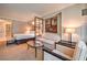 Comfortable living space including sofa, chairs, glass table, large framed artwork and king bed at 135 E Harmon Ave # 809, Las Vegas, NV 89109