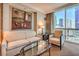 Elegant living room with stylish seating and a large window offering city views at 135 E Harmon Ave # 809, Las Vegas, NV 89109