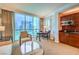 Inviting living room with a cozy seating area, kitchenette, and a fantastic city view at 135 E Harmon Ave # 809, Las Vegas, NV 89109