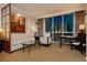 Comfortable living room with stylish decor, art, and large windows offering views of the city skyline at 135 E Harmon Ave # 809, Las Vegas, NV 89109