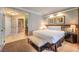 Cozy main bedroom with en-suite bathroom, neutral walls and flooring, and a luxurious bed at 135 E Harmon Ave # 809, Las Vegas, NV 89109