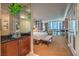 Well-appointed main bedroom with a glimpse of city views and an en-suite bathroom at 135 E Harmon Ave # 809, Las Vegas, NV 89109