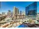 Striking view of the Vegas skyline and pool, visible from the condo at 135 E Harmon Ave # 809, Las Vegas, NV 89109