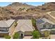 Mountain view behind desert home featuring desert landscaping and solar panels at 145 Langley Hill Ave, Henderson, NV 89002