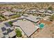 Expansive aerial view of a modern home featuring a private pool and solar panels in a vibrant neighborhood at 145 Langley Hill Ave, Henderson, NV 89002