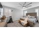 Bedroom with gray walls, carpet, modern ceiling fan, and an exercise bike at 145 Langley Hill Ave, Henderson, NV 89002