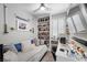 Bedroom with daybed, built-in shelves, ceiling fan, and a window at 145 Langley Hill Ave, Henderson, NV 89002