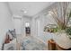 Inviting hallway with neutral colors, decorative niche, and views into the adjacent rooms at 145 Langley Hill Ave, Henderson, NV 89002