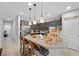 Kitchen featuring granite countertops, stainless steel appliances, a pantry, and an eat-in island at 145 Langley Hill Ave, Henderson, NV 89002