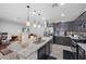 Kitchen featuring granite countertops, stainless steel appliances, and an island at 145 Langley Hill Ave, Henderson, NV 89002