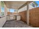 Covered patio with a built-in stainless steel grill and convenient storage at 145 Langley Hill Ave, Henderson, NV 89002