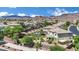 A beautiful neighborhood featuring mountain views and lush landscaping at 15 Imposing Knoll Ave, Henderson, NV 89002
