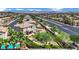 A landscaped backyard with a pool and patio highlights this home's outdoor living at 15 Imposing Knoll Ave, Henderson, NV 89002
