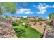 View of a manicured backyard with artificial turf at 15 Imposing Knoll Ave, Henderson, NV 89002