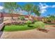 Backyard showcasing artificial turf and desert landscaping at 15 Imposing Knoll Ave, Henderson, NV 89002