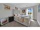 Comfortable bedroom featuring a well-lit space and a large tufted headboard at 15 Imposing Knoll Ave, Henderson, NV 89002