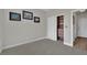 Clean bedroom with closet featuring built-in shelving and drawers, plus three art pieces on the wall at 15 Imposing Knoll Ave, Henderson, NV 89002