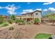Exterior rear view of home, partial deck, and landscaped backyard at 15 Imposing Knoll Ave, Henderson, NV 89002