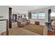 Comfortable living room with cozy reclining love seat and decorative rug at 15 Imposing Knoll Ave, Henderson, NV 89002