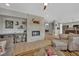 Open-concept living room with fireplace, comfortable seating, and seamless flow to the kitchen at 15 Imposing Knoll Ave, Henderson, NV 89002