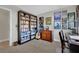 Office with large bookcase and desk featuring vinyl records and posters at 15 Imposing Knoll Ave, Henderson, NV 89002