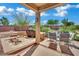 Well-appointed outdoor dining with a covered patio, offering comfort and style for al fresco gatherings at 15 Imposing Knoll Ave, Henderson, NV 89002