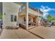 Comfortable outdoor patio with stylish furniture, and a built-in kitchen, perfect for entertaining at 15 Imposing Knoll Ave, Henderson, NV 89002
