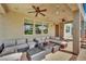 Spacious covered patio with ceiling fans, ample seating, and a clear view of the backyard at 15 Imposing Knoll Ave, Henderson, NV 89002