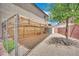 Pet enclosure with roof, fencing and artificial turf in spacious backyard at 15 Imposing Knoll Ave, Henderson, NV 89002