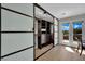 Custom walk-in closet with built-in shelving, drawers, and access to outdoor balcony at 15 Imposing Knoll Ave, Henderson, NV 89002