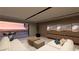 Modern living room featuring cozy seating and a balcony with ocean views at 1516 Pleasant Bay Ct, Henderson, NV 89011