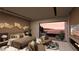 Relaxing main bedroom with seating area, fireplace, and outdoor views at 1516 Pleasant Bay Ct, Henderson, NV 89011