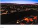 Night aerial shot showcasing a residential neighborhood with visible rooftops and community street lights at 1557 Blue Sierra Ct, Henderson, NV 89074
