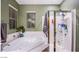 Stylish bathroom featuring a soaking tub, a separate glass-enclosed shower, and a large window for natural light at 1557 Blue Sierra Ct, Henderson, NV 89074