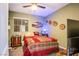 Inviting bedroom with carpet, a ceiling fan, and a dresser creating a relaxing retreat at 1557 Blue Sierra Ct, Henderson, NV 89074