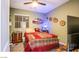 Cozy bedroom featuring plush bedding, a ceiling fan, and a dresser, creating a comfortable and inviting space at 1557 Blue Sierra Ct, Henderson, NV 89074