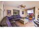 Inviting living room offers comfortable leather seating, an entertainment center, and ample natural light at 1557 Blue Sierra Ct, Henderson, NV 89074