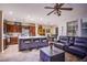 Open-concept living area featuring a kitchen, dining space, and comfortable seating at 1557 Blue Sierra Ct, Henderson, NV 89074