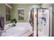 Stylish main bathroom featuring a soaking tub, shower, and a window providing natural light at 1557 Blue Sierra Ct, Henderson, NV 89074