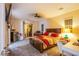 Comfortable main bedroom features a balcony and ample natural light, with neutral tones and modern fixtures at 1557 Blue Sierra Ct, Henderson, NV 89074