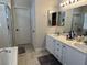 Bathroom with double sinks, updated fixtures, a separate shower, and soaking tub at 1812 Warrenville St, Las Vegas, NV 89117
