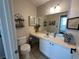 View of a well-lit bathroom featuring a vanity with storage and tasteful decor at 1812 Warrenville St, Las Vegas, NV 89117