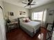 Comfortable bedroom featuring hardwood floors, natural light, and a ceiling fan at 1812 Warrenville St, Las Vegas, NV 89117