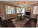 Formal dining room with modern chandelier, dining table, and decorative curtains at 1812 Warrenville St, Las Vegas, NV 89117