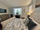 Cozy bedroom featuring a plush bed, ample natural light, and decorative accents at 1812 Warrenville St, Las Vegas, NV 89117